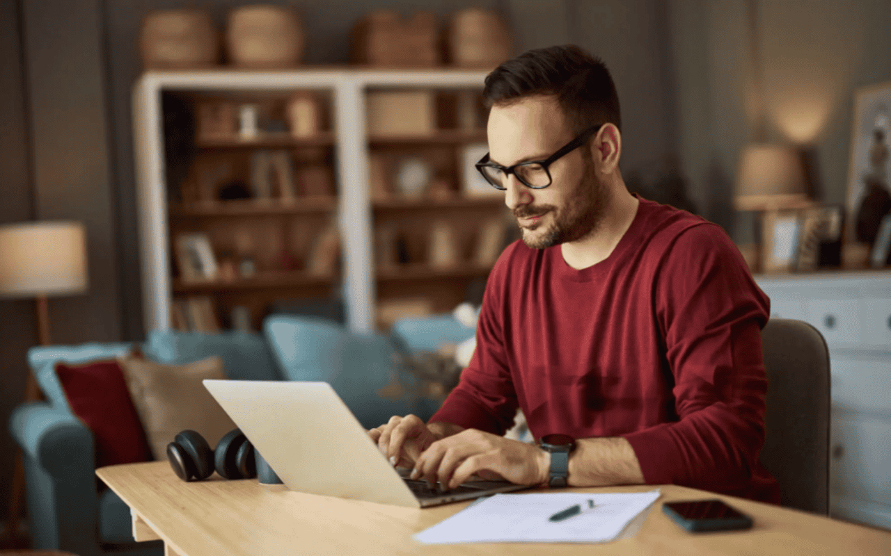 Man using laptop to find online business ideas