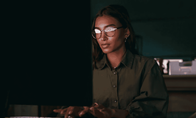 Woman researching how to become a copywriter at night