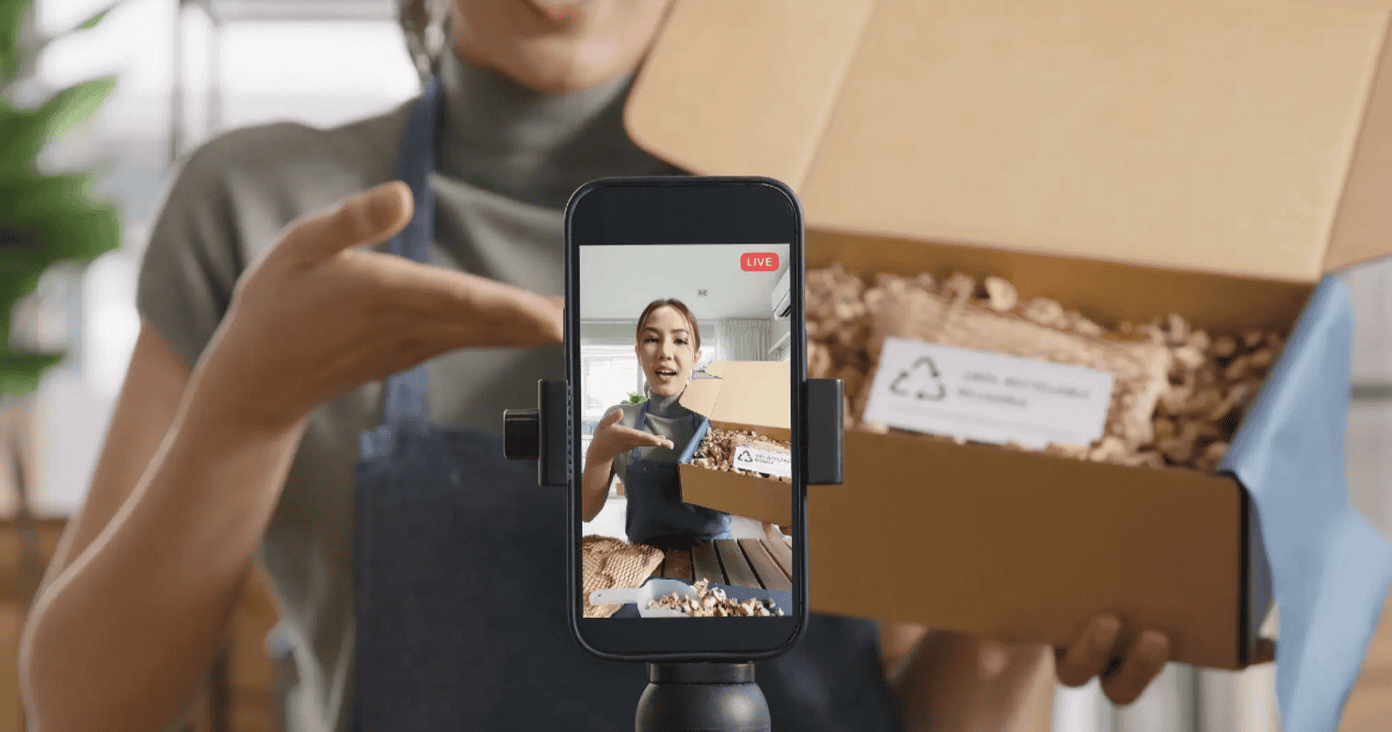 Asian woman shooting a video for her ecommerce site
